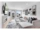Bright living room with modern fireplace, large sectional sofa, and stylish decor at 3103 W 18Th Ave, Denver, CO 80204