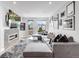 Modern living room featuring stylish sectional, fireplace, and artwork, offering a cozy and chic atmosphere at 3103 W 18Th Ave, Denver, CO 80204