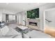 Inviting living room with a modern fireplace, large screen TV, and comfortable sectional sofa at 3103 W 18Th Ave, Denver, CO 80204