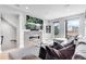 Light-filled living room with a modern fireplace, large sectional, and contemporary design elements at 3103 W 18Th Ave, Denver, CO 80204