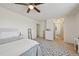 View of a bedroom with neutral tones, patterned rug, closet, and ensuite bathroom access at 1001 S Nucla St, Aurora, CO 80017