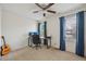 Bedroom featuring desk, chair, and a guitar at 1001 S Nucla St, Aurora, CO 80017