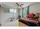 Bedroom with fan, mounted TV, and sports themed decor at 1001 S Nucla St, Aurora, CO 80017