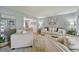 Bright living room with stylish furnishings, hardwood floors, and a view into the dining area at 1001 S Nucla St, Aurora, CO 80017