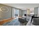 Inviting living room with hardwood floors, sliding glass doors, and comfortable sofa at 1001 S Nucla St, Aurora, CO 80017