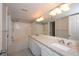 Updated bathroom featuring a dual granite vanity with modern faucets and a shower-tub combination at 1785 Morrison Ct, Superior, CO 80027