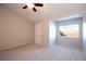 Bright bedroom features neutral carpet, a ceiling fan, and a window with a view at 1785 Morrison Ct, Superior, CO 80027