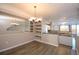 Dining area with modern lighting, built-in shelving, and convenient access to the updated kitchen at 1785 Morrison Ct, Superior, CO 80027