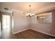 Dining room with hardwood floors, chandelier, and a large mirror at 1785 Morrison Ct, Superior, CO 80027