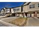 Charming townhomes with brick accents and driveways leading to attached garages at 1785 Morrison Ct, Superior, CO 80027