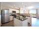 Bright kitchen features stainless steel appliances, granite countertops, island, and an open floorplan at 1785 Morrison Ct, Superior, CO 80027