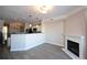 Open concept living area featuring new flooring and a modern fireplace at 1785 Morrison Ct, Superior, CO 80027