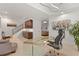 Bright basement office area featuring a kitchenette, glass desk, and modern lighting, creating an inspiring workspace at 318 Adams St, Denver, CO 80206