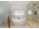 Modern bathroom featuring a soaking tub and a walk-in shower at 318 Adams St, Denver, CO 80206