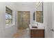 Bright bathroom featuring large shower, modern vanity, and ample natural light from window at 318 Adams St, Denver, CO 80206