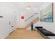 Welcoming entryway with hardwood floors and modern staircase at 318 Adams St, Denver, CO 80206
