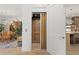 View of a hallway with an elevator visible; the dining room and kitchen are on either side of the hall at 318 Adams St, Denver, CO 80206