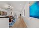 Bright hallway with modern lighting and beautiful artwork leading to a cozy seating area at 318 Adams St, Denver, CO 80206