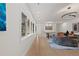 Bright hallway with wood floors, recessed lighting, and modern decor leading to seating area at 318 Adams St, Denver, CO 80206