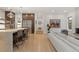 Open concept kitchen flowing into the living area, featuring a large island and stainless steel appliances at 318 Adams St, Denver, CO 80206
