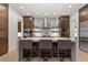 Stylish kitchen island with bar seating, modern pendant lighting, and sleek cabinetry at 318 Adams St, Denver, CO 80206
