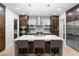 Modern kitchen with island seating, stainless appliances, custom cabinetry, and stone countertops at 318 Adams St, Denver, CO 80206