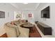 Cozy living room with a large sectional sofa, accent pillows, and modern entertainment center at 318 Adams St, Denver, CO 80206