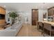 Spacious living room flows into kitchen, featuring hardwood floors and natural light at 318 Adams St, Denver, CO 80206