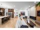 Open concept living room featuring fireplace, hardwood floors, and view to kitchen at 318 Adams St, Denver, CO 80206
