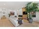 Bright living room with hardwood floors, fireplace, and a comfortable white couch at 318 Adams St, Denver, CO 80206