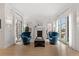 Elegant living room with hardwood floors, a fireplace, and ample natural light from surrounding windows at 318 Adams St, Denver, CO 80206