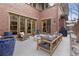 A private outdoor patio with fireplace and comfortable seating with access to the home's interior at 318 Adams St, Denver, CO 80206