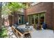Charming outdoor patio with cozy seating and mature tree at 318 Adams St, Denver, CO 80206