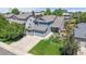 Aerial view of a two-story home, boasting an attached three-car garage and well-manicured landscaping at 4826 S Ireland St, Aurora, CO 80015