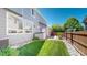 Well-maintained backyard with a storage shed, mature trees, and grass at 4826 S Ireland St, Aurora, CO 80015