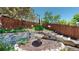 Charming backyard landscaping featuring a birdbath and lush greenery creates a serene and inviting outdoor space at 4826 S Ireland St, Aurora, CO 80015