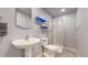 This efficient bathroom features a stand-up shower and pedestal sink at 4826 S Ireland St, Aurora, CO 80015