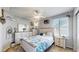 Bright bedroom with a ceiling fan, fresh paint, and a large window at 4826 S Ireland St, Aurora, CO 80015