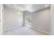 Bright bedroom with neutral paint and carpet and a basement window at 4826 S Ireland St, Aurora, CO 80015