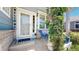 Inviting front porch with a welcome sign, chair, and climbing vines, creating a cozy and charming entrance at 4826 S Ireland St, Aurora, CO 80015