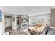 Inviting living room featuring a modern fireplace, built-in shelves, and a comfortable seating area with ample natural light at 4826 S Ireland St, Aurora, CO 80015
