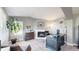 Inviting home office with a fireplace, large desk, comfortable seating, and natural light at 4826 S Ireland St, Aurora, CO 80015