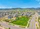 An aerial view of a community park and playground against a mountain backdrop at 9350 Dunraven St, Arvada, CO 80007
