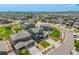 High angle picture of several residential homes, showing the roofs, yards and driveways at 9350 Dunraven St, Arvada, CO 80007