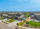 Community view with homes, sidewalks, and green spaces at 9350 Dunraven St, Arvada, CO 80007