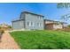 An expansive backyard with healthy green lawn and wood fencing at 9350 Dunraven St, Arvada, CO 80007