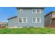 Spacious backyard featuring lush lawn and wood fencing at 9350 Dunraven St, Arvada, CO 80007