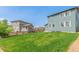 Spacious backyard with grass lawn and wood fencing at 9350 Dunraven St, Arvada, CO 80007