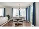 Bright dining room with hardwood floors, natural light, and comfortable seating at 9350 Dunraven St, Arvada, CO 80007