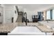 Open-concept kitchen with a farmhouse sink, granite countertops, and an open view to the living room at 9350 Dunraven St, Arvada, CO 80007